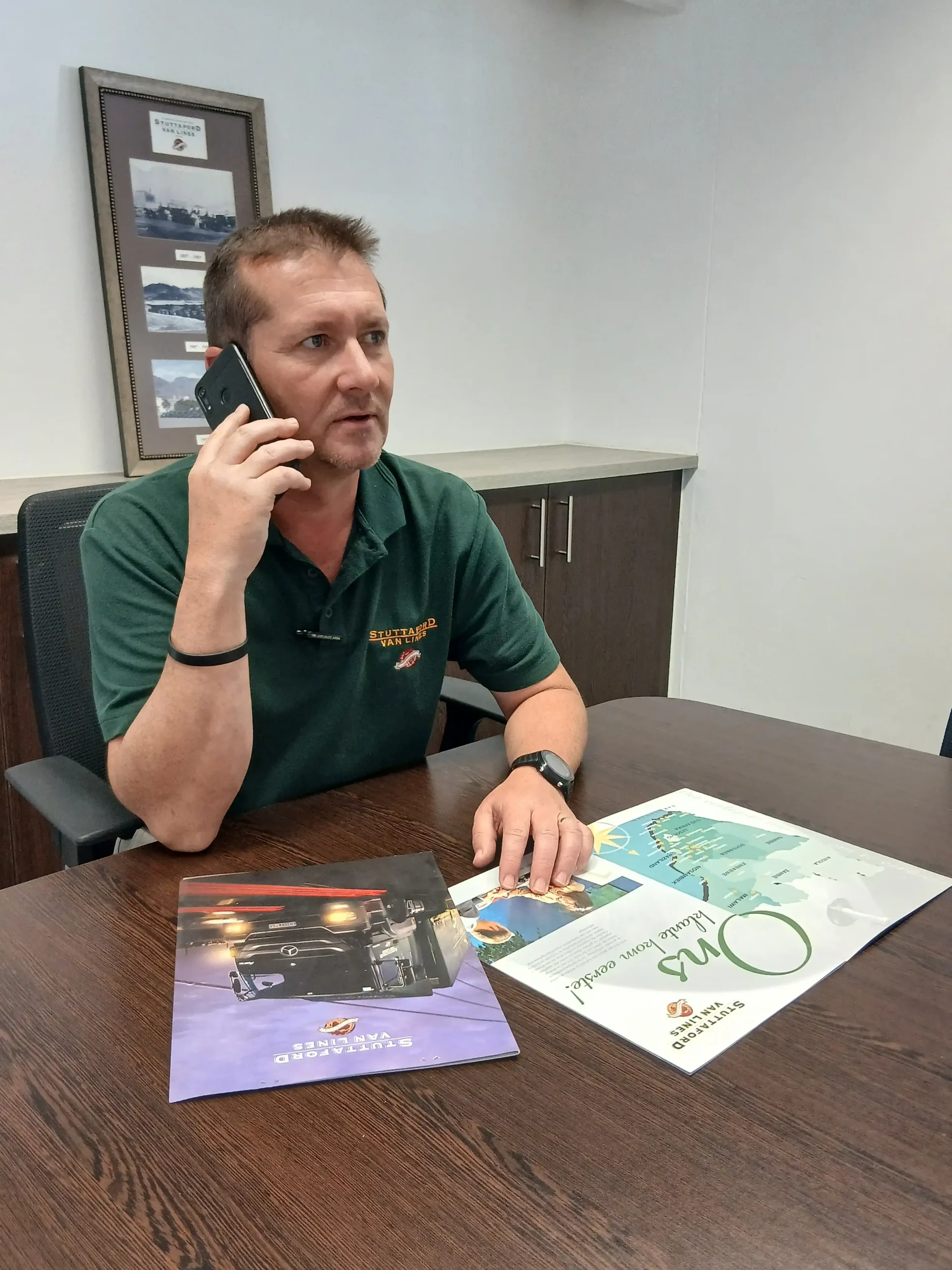 Stuttaford Van Lines Windhoek Branch Manager assisting a customer by phone with moving and relocation requirements in Namibia.